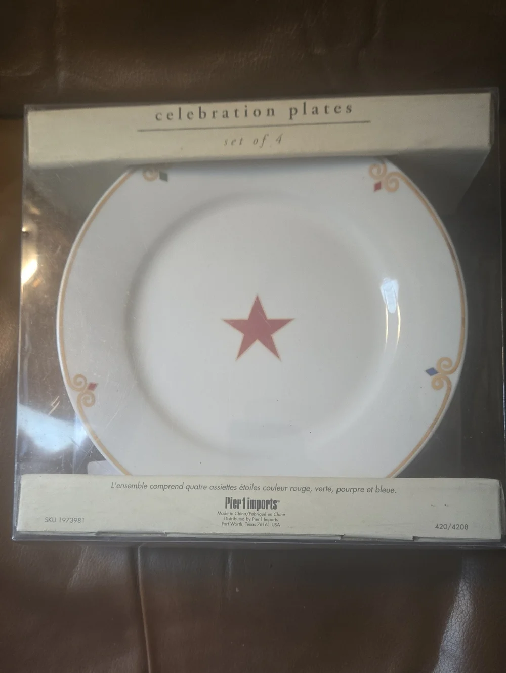Pier 1 White Dinner Plate with Red Star and Gold Trim